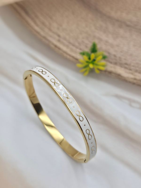 Infinity symbol motif white enamel gold bangle-style bracelet