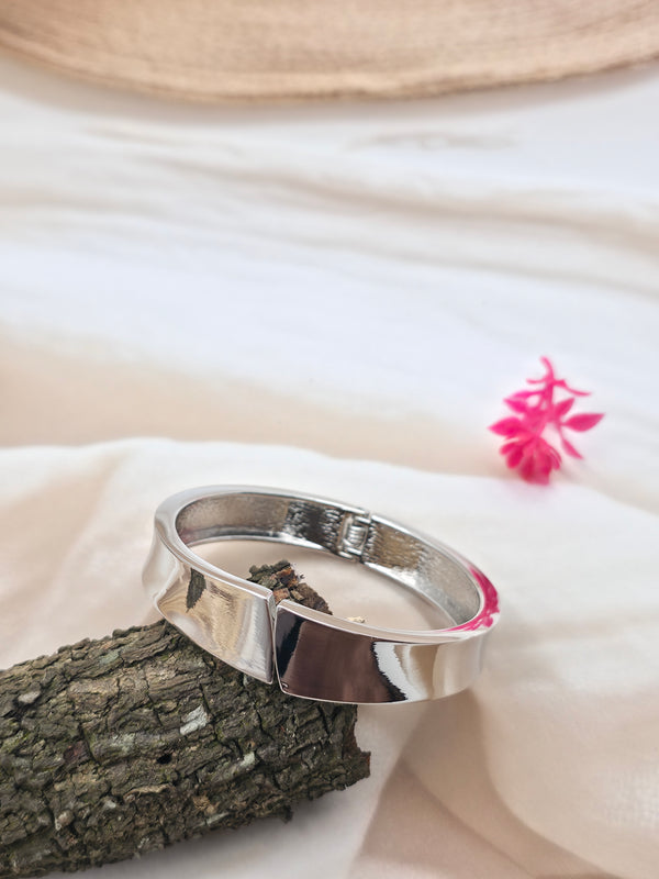 silver-toned metal cuff bracelet