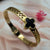 Gold-Tone Bangle with Black Clover Bracelet