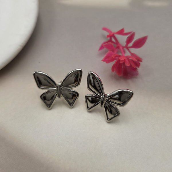 Silver-toned or gunmetal butterfly stud earrings.