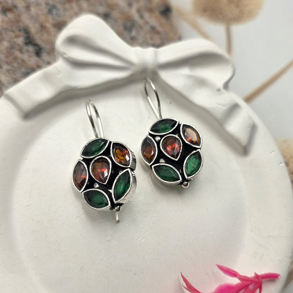Dangle green stones earrings