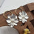 Flower motif statement earrings