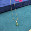 bright, polished gold tone pendant necklace