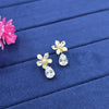 small, stylized flower stud earrings