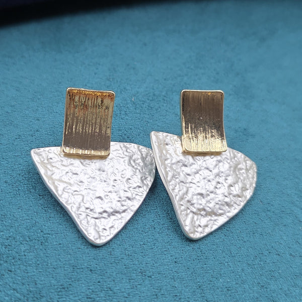 brushed or textured gold-tone finish.