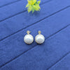 creamy faux pearl stud earrings.