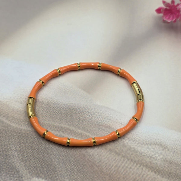 gold-toned bamboo-link design bracelet.