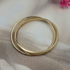 polished gold-tone metal bangle bracelet