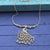 oxidized silver or silver-tone metal necklace peacock pendant.