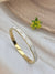 Infinity symbol motif white enamel gold bangle-style bracelet
