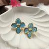 Flower-shaped stud earrings.