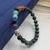 beaded stretch bracelet Buddha head charm