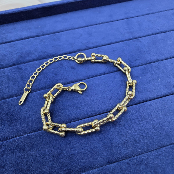 gold-tone chain-link bracelet