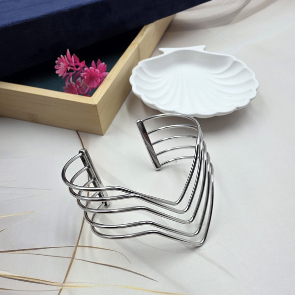 silver-toned metal cuff bracelet.