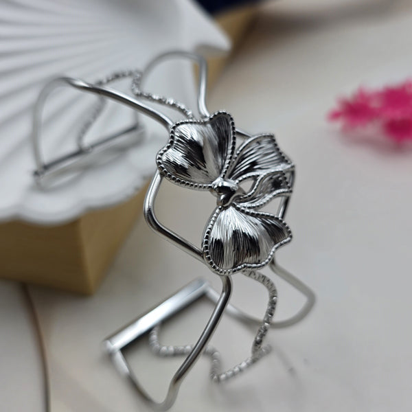 silver-toned metal cuff bracelet