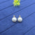 creamy faux pearl stud earrings.