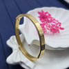 gold-tone bangle bracelet