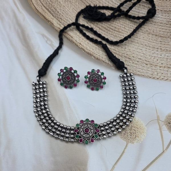 choker necklace and earring set.
